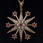 Australian 9ct Starburst Pendant Pearl and Ruby Doublets Brooch. Click for more information...