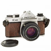 Pentax. K1000 SE. Film Camera. s/n 6560324. Brown Leather with SMC 50mm F2 Lens. Click for more information...